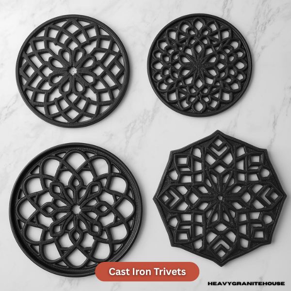 Heavy-duty red enameled cast iron trivet protecting a dark granite countertop
